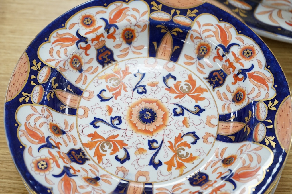 Fifteen items of a mid 19th century Mason's/Ashworth’s ironstone dinner service. Oval meat platter 48.5cm wide. Condition - three plates chipped, some losses to gilding